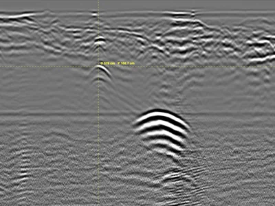 Unrecorded Utility Crossing Under a Street — Parallel GPR Profiles at 350 MHz